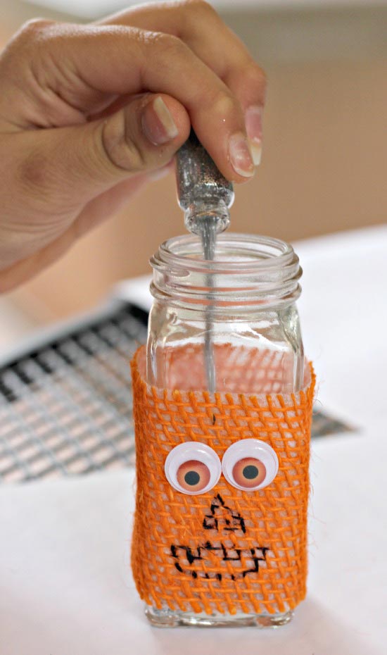 pumpkin sensory bottle with glitter for Halloween